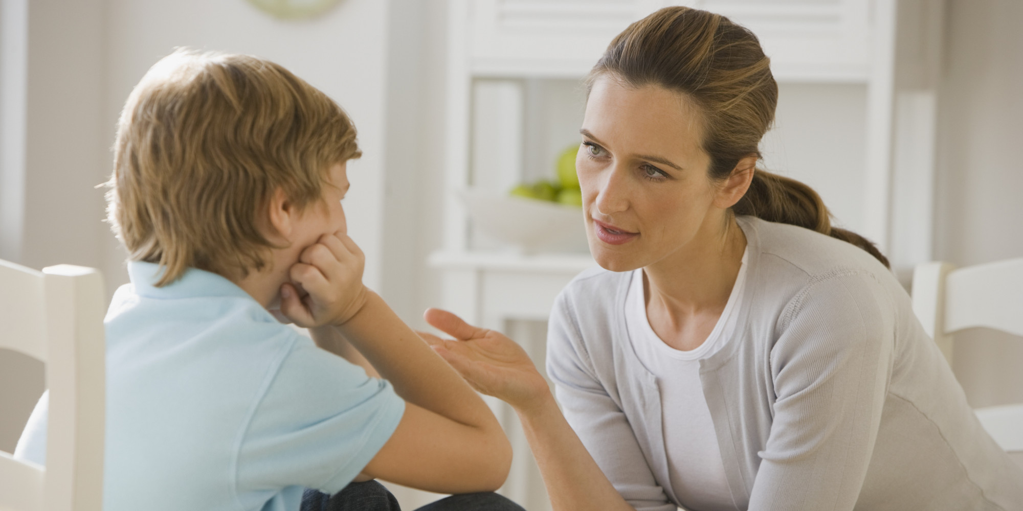 Mother having discussion with son